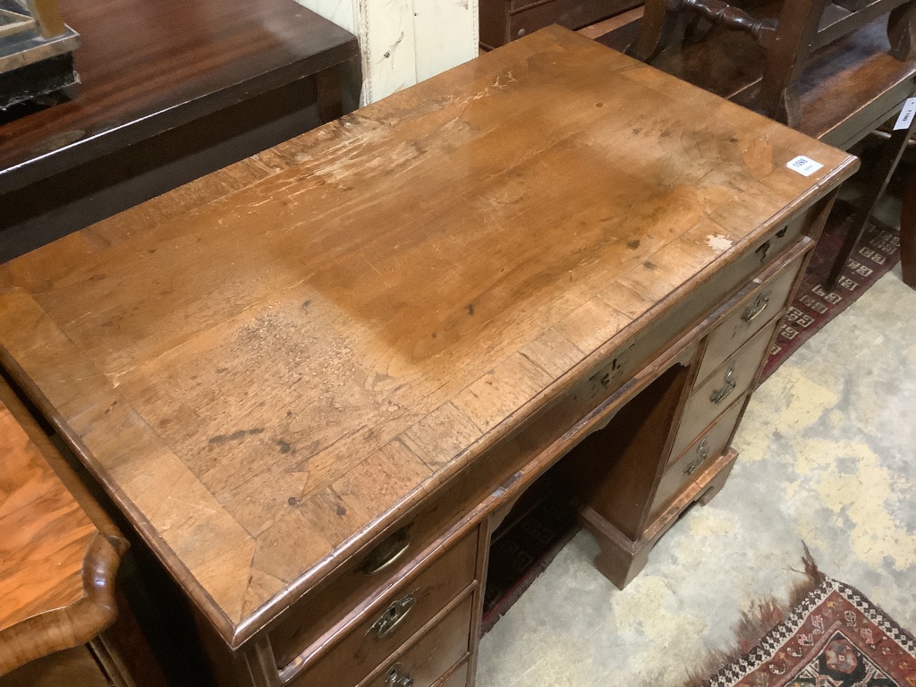 A William and Mary walnut and herringbone strung kneehole desk, length 101cm, depth 55cm, height 79cm